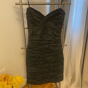 BCBG MAXAZRIA Strapless black cocktail dress.
